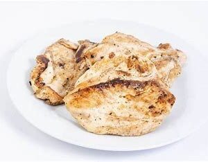 Grilled chicken breasts on a white plate.