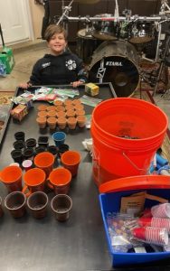 A table with cups and buckets on it