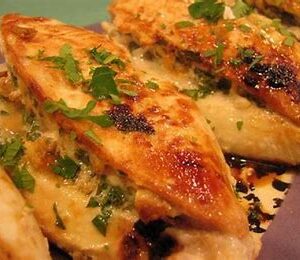 Stuffed chicken breasts with herbs and sauce.